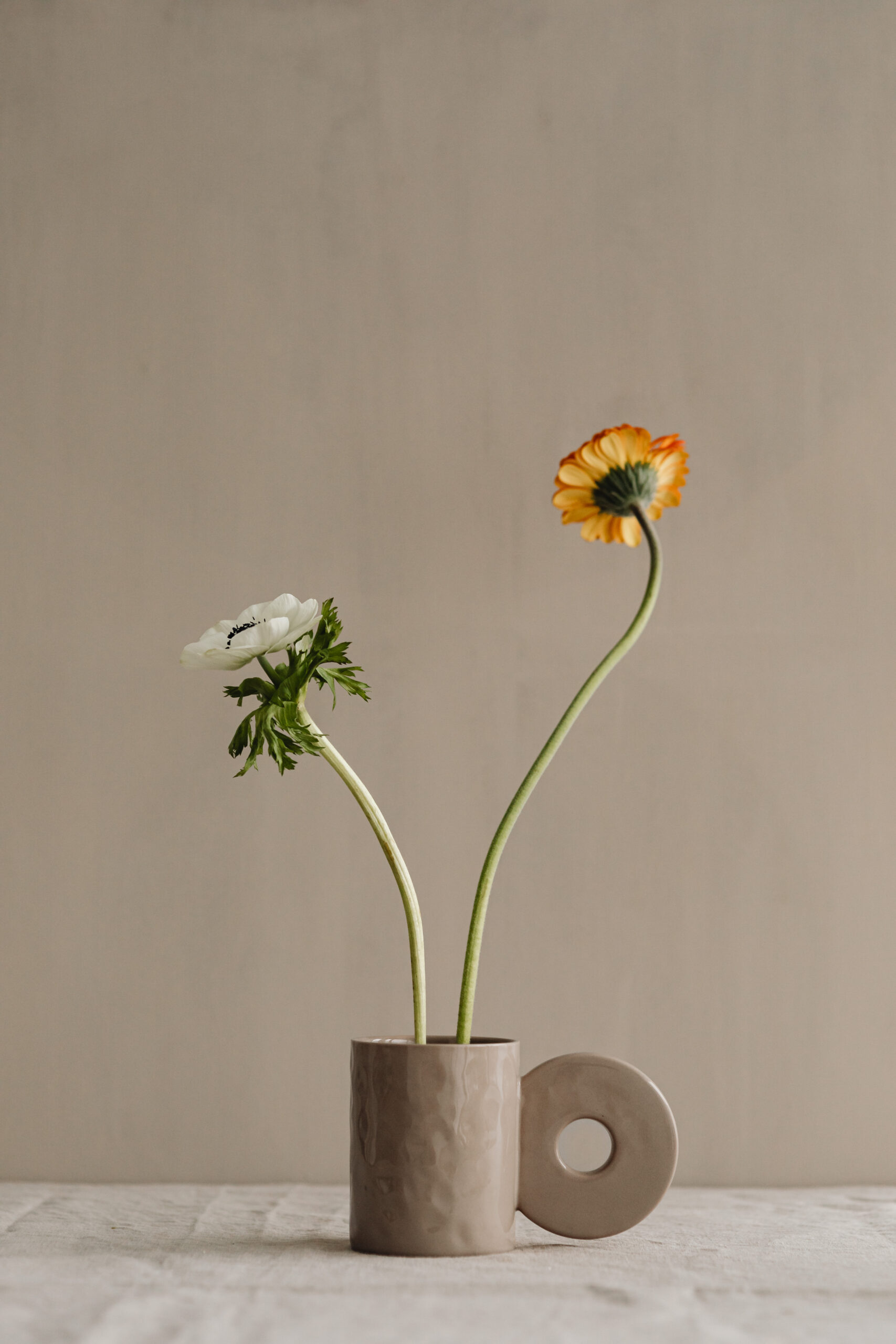 Flower growing out of a pot of water symbolizing personal growth and emotional healing
