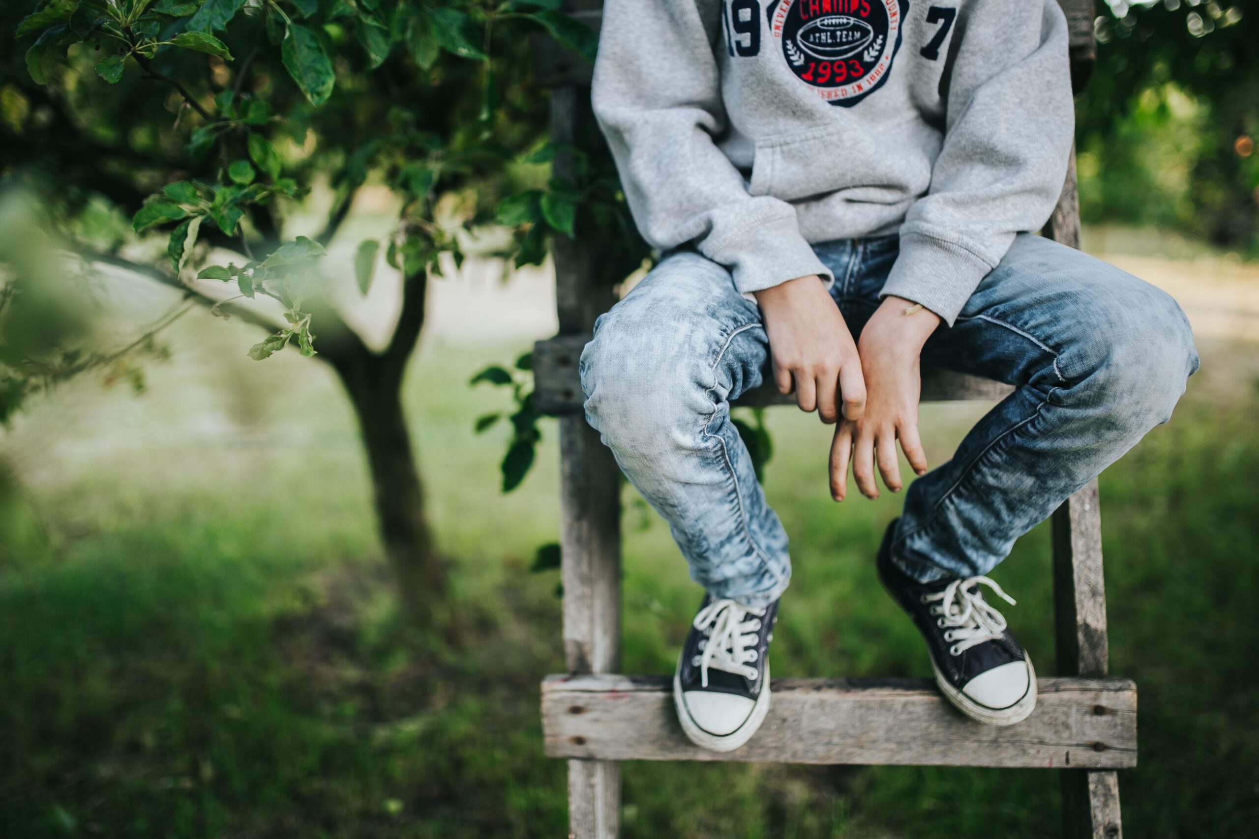 Teen boy contemplating about teen therapy in the woodlands